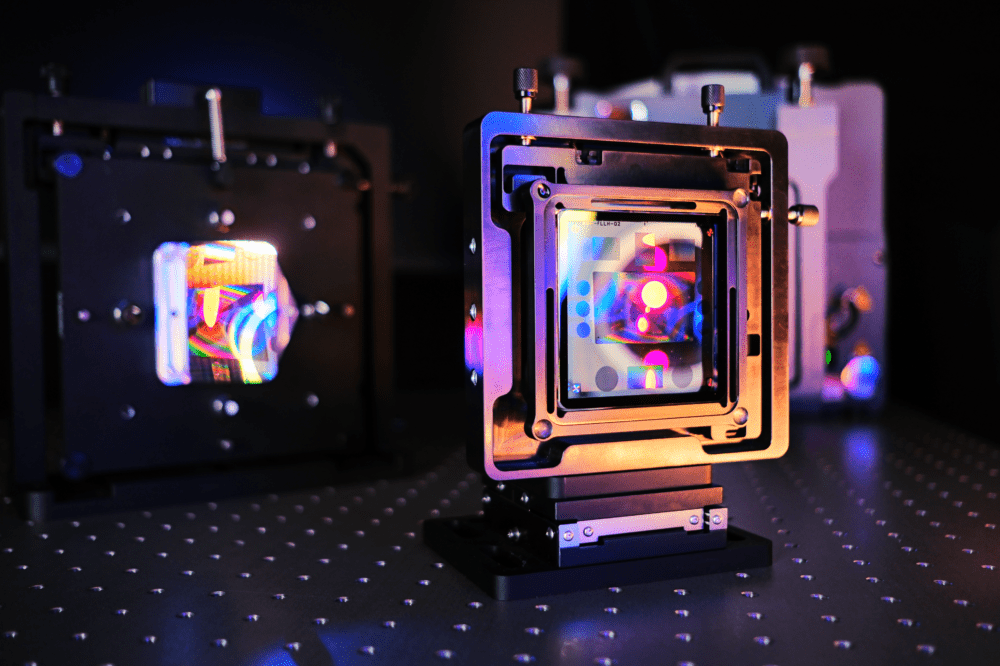 Rainbow reflections on an AOM computer-generated hologram (CGH) and a freeform optic