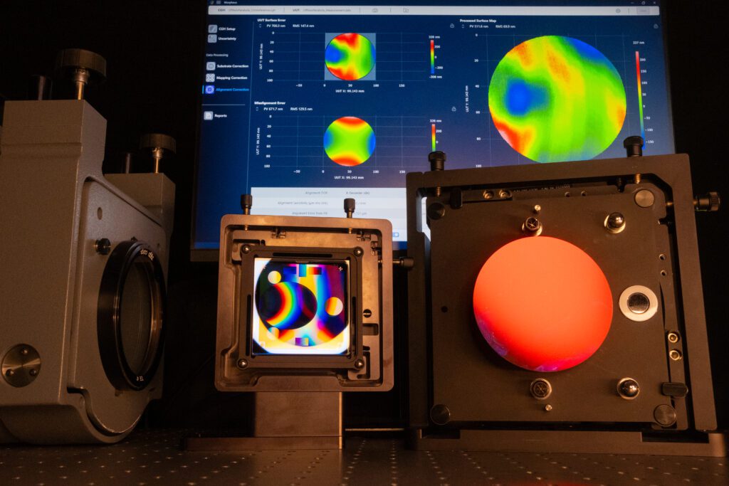 Morpheus data processing software is visible behind an AOM CGH and an off-axis parabolic optic reflecting light.